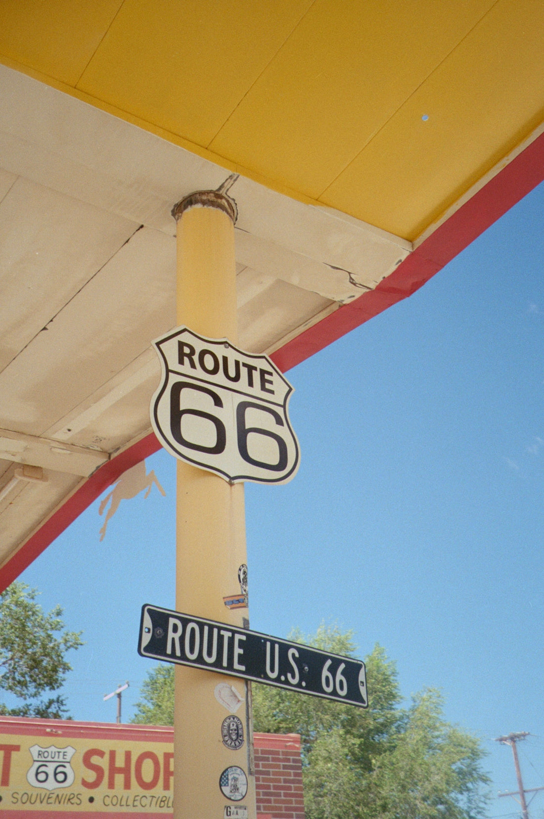 Route 66 sign on a yellow pole
