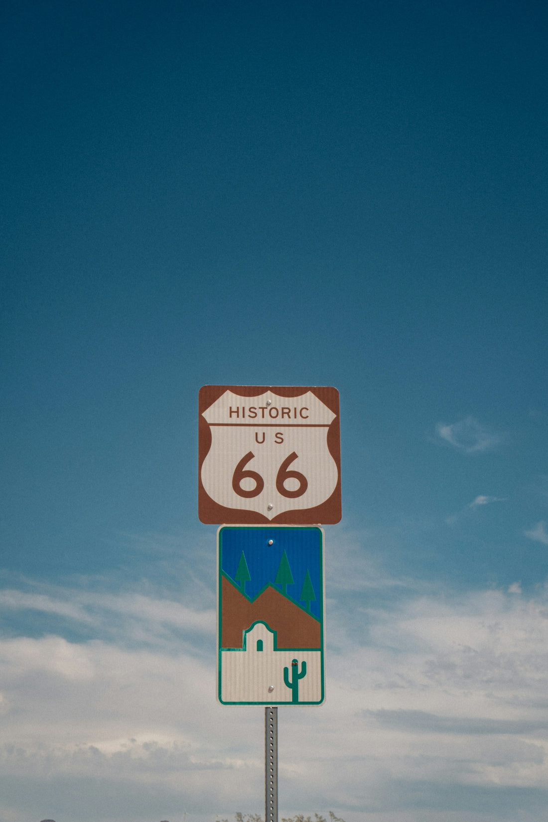 Historic us 66 sign with desert landscape