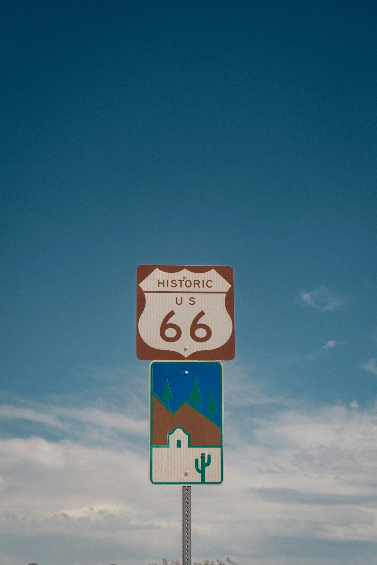 Historic us 66 sign with desert landscape